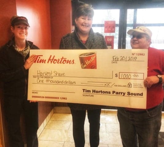Bowes Street Timmies’ staff donate $1,000 in tips to local food bank